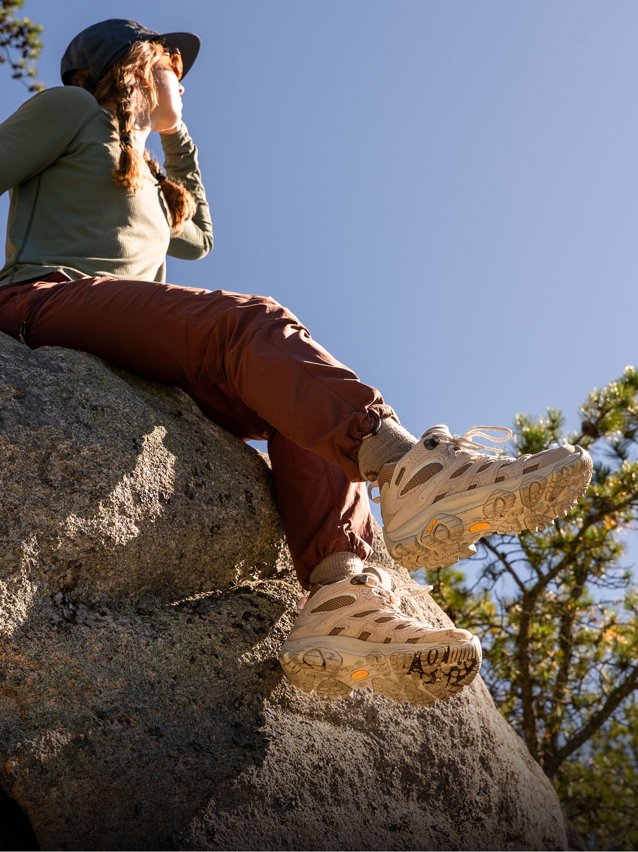 Person wearing Moab Speed 2 GORE-TEX shoes on a rocky trail.